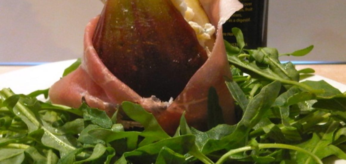 Fig wrapped in prosciutto filled with blue cheese and Vino Cotto